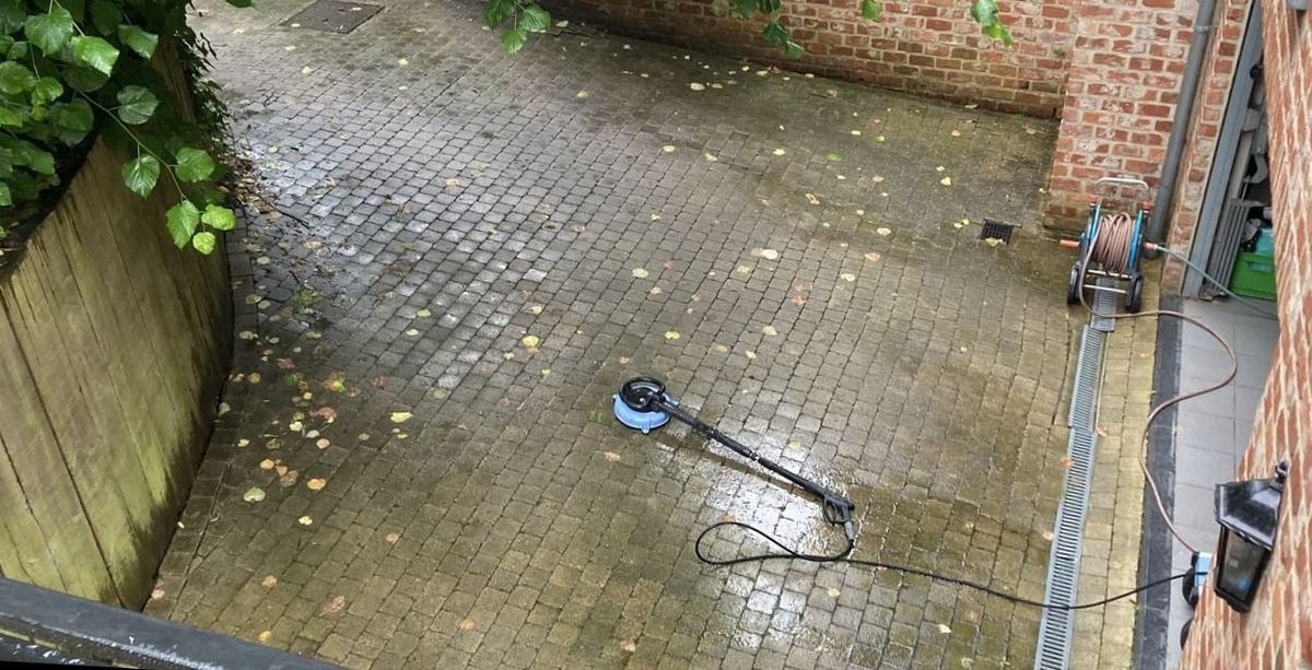 Paved courtyard before cleaning