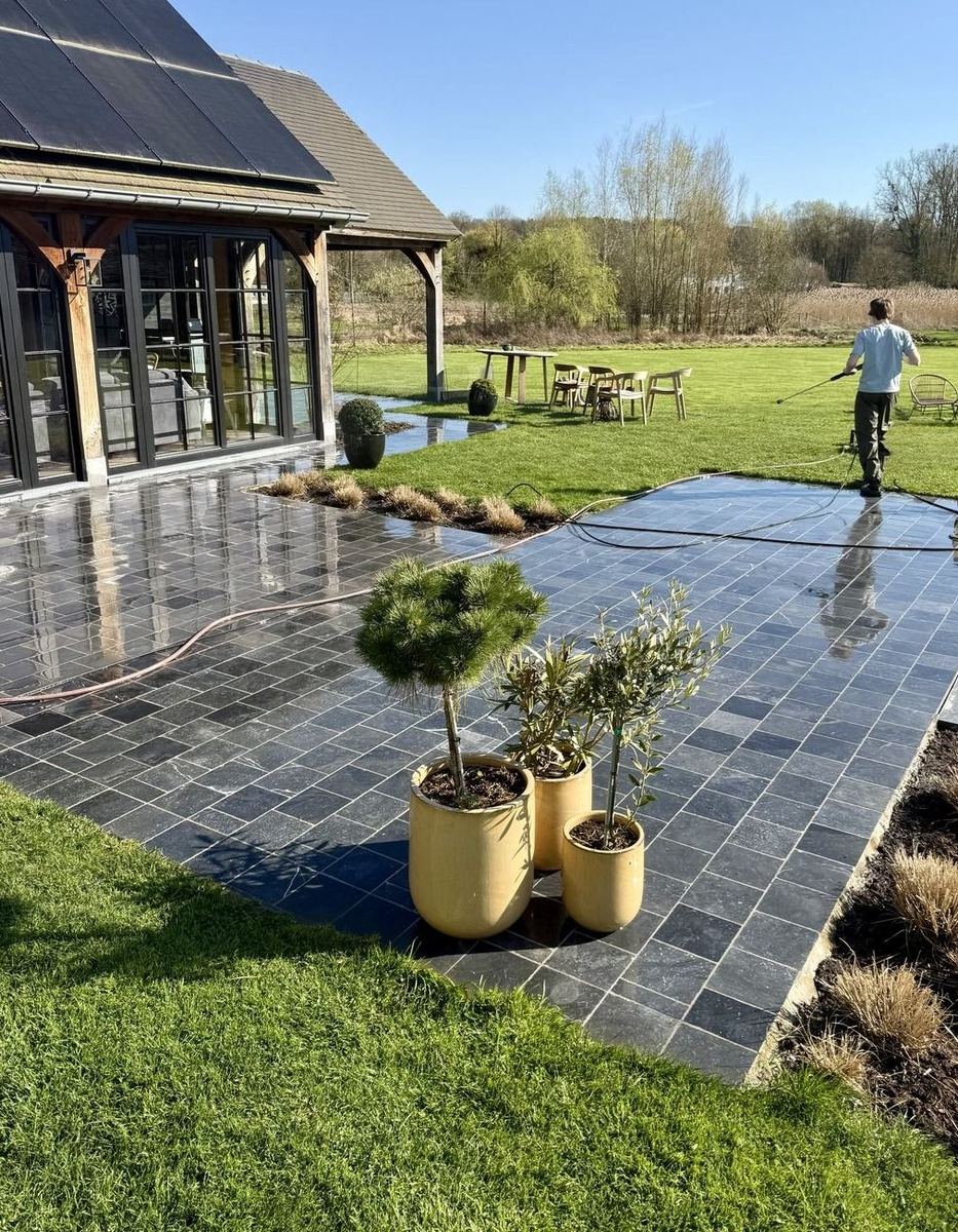 Large natural stone patio mid high-pressure clean